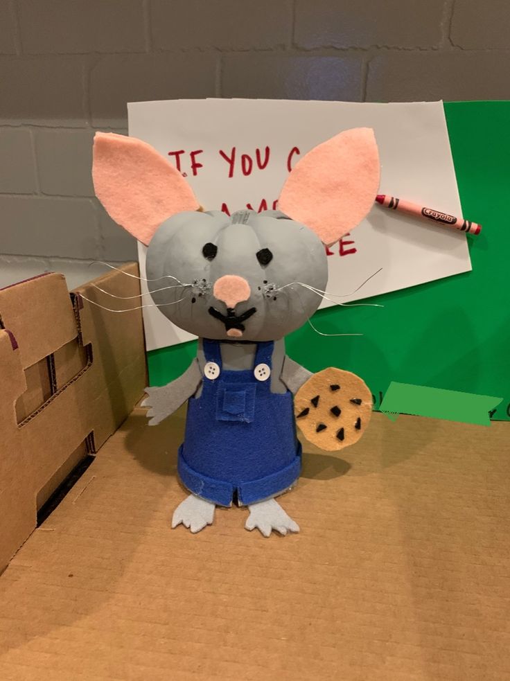 Charming Craft Mouse Character: Blue Overall, Cookie, and Whimsical Design for Kids' Projects.