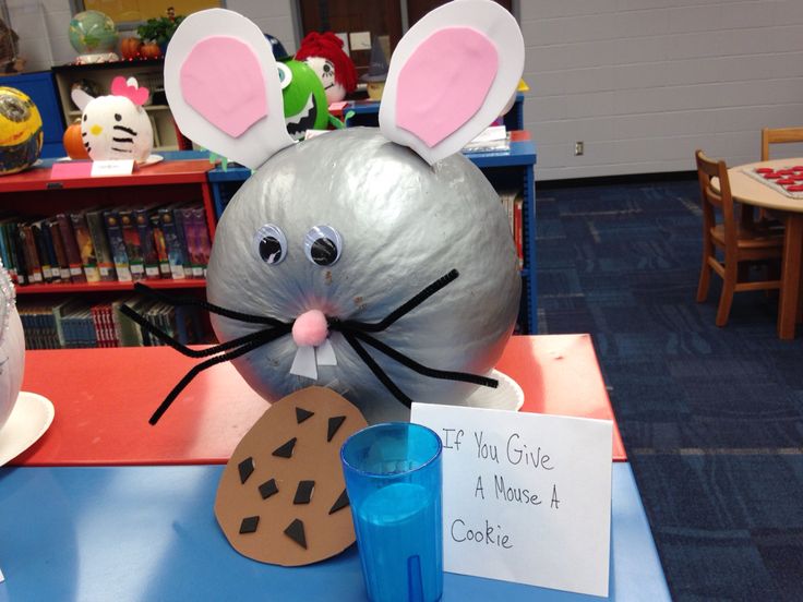 Charming Whimsical Mouse Craft: Playful Design with Cookie Cut-Out and Blue Cup Accents.