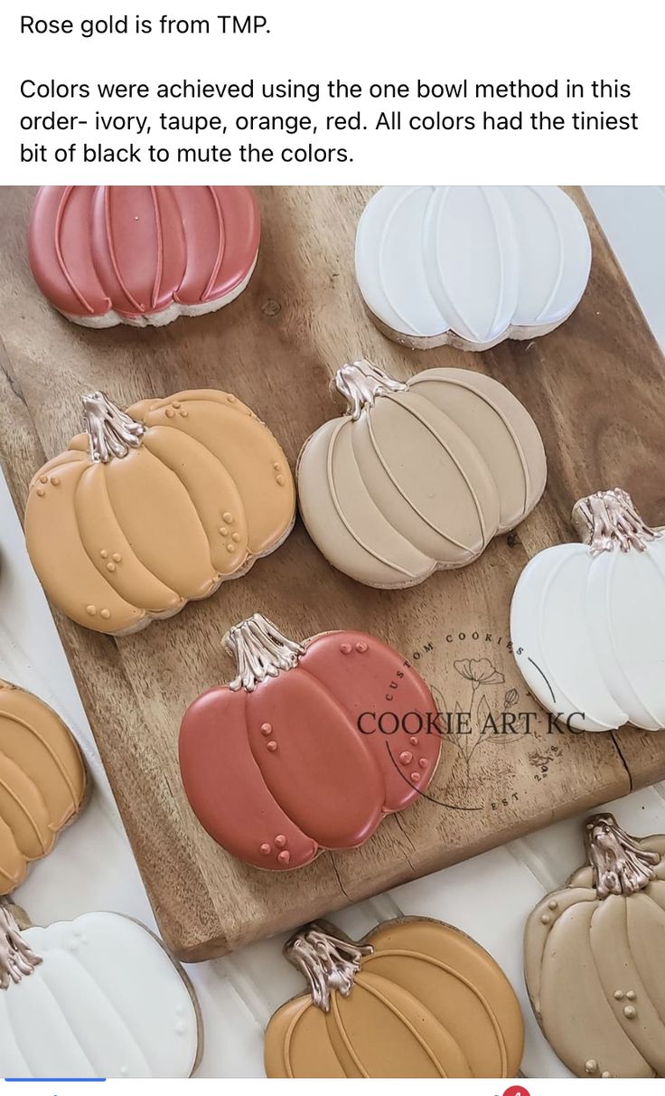 Cozy Autumn Aesthetic: Colorful Pumpkin-Shaped Cookies on a Wooden Platter