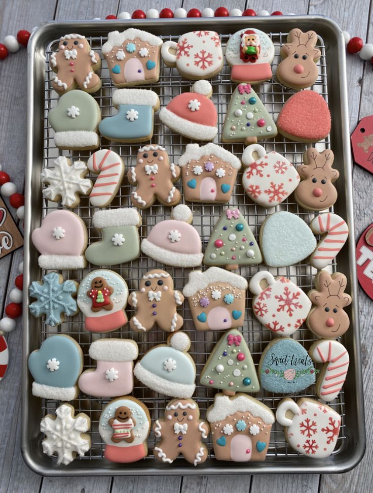 Whimsical Holiday Cookie Designs: Gingerbread Houses, Reindeer, and Festive Mittens with Pastel Frostings.