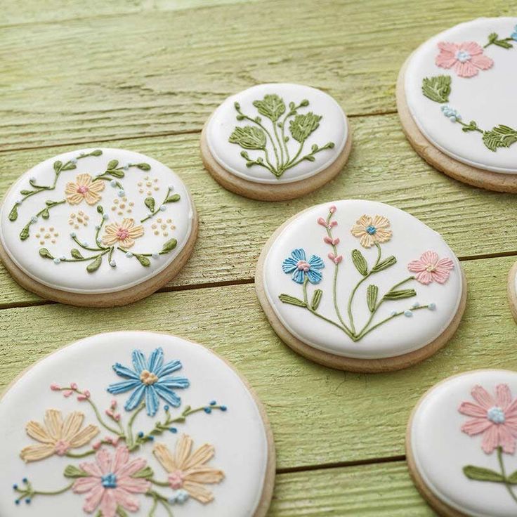 Elegant Floral Nail Design Inspiration with Hand-Painted Blossoms on Cream Background.