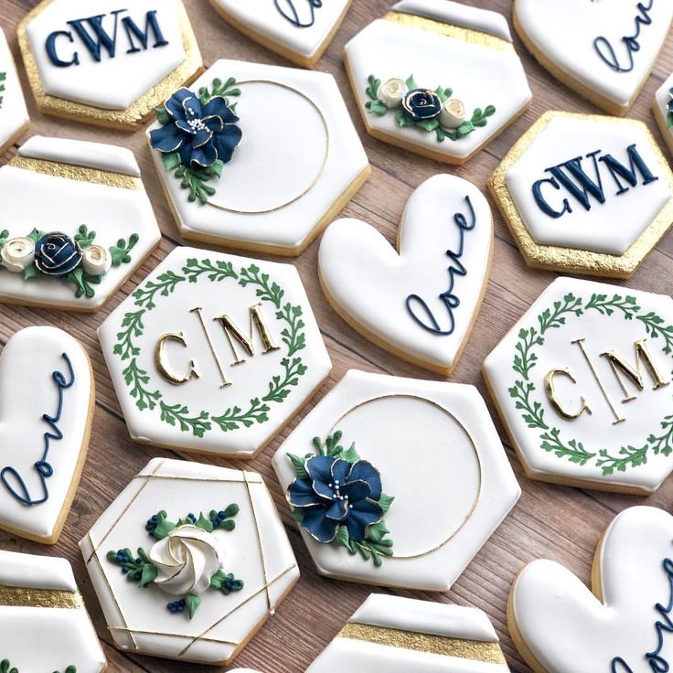 Elegant Decorative Cookies with Intricate Floral and Geometric Designs in a Chic Color Palette.