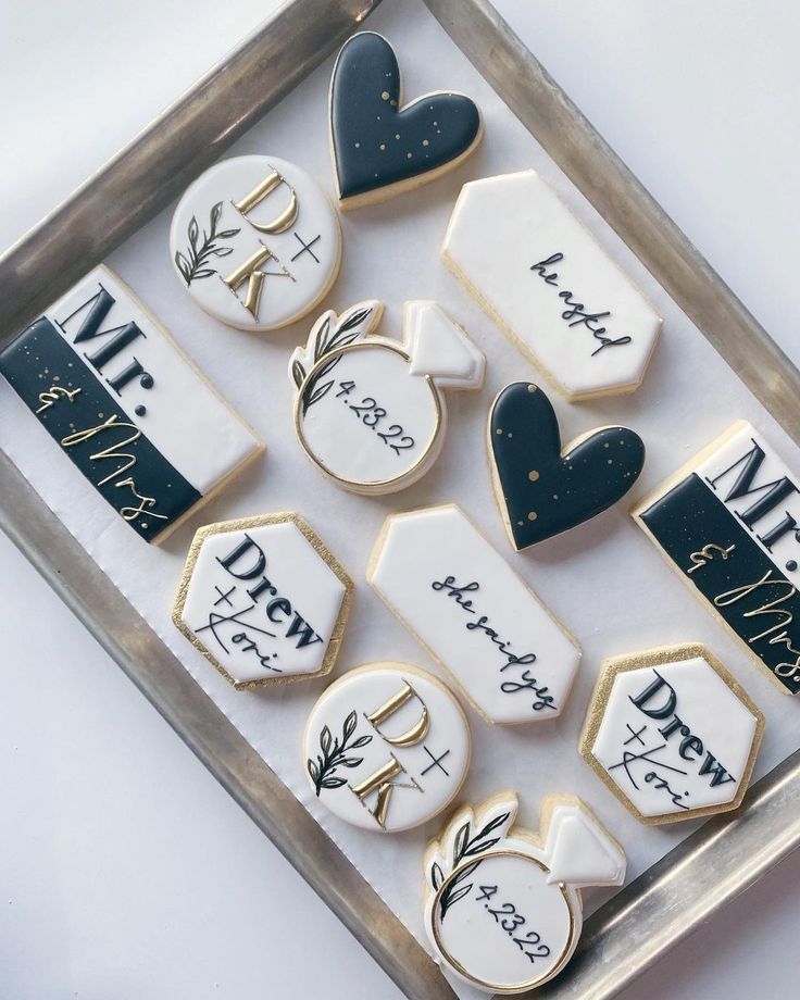 Sophisticated Wedding Cookie Design with Shapes, Messages, and a Chic Navy, White, and Gold Palette.