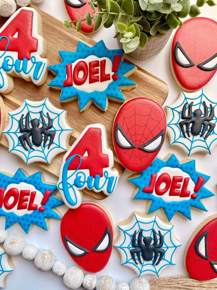 Playful Spider-Man Cookies: Bold Red and Blue Designs for a Superhero Birthday Celebration.