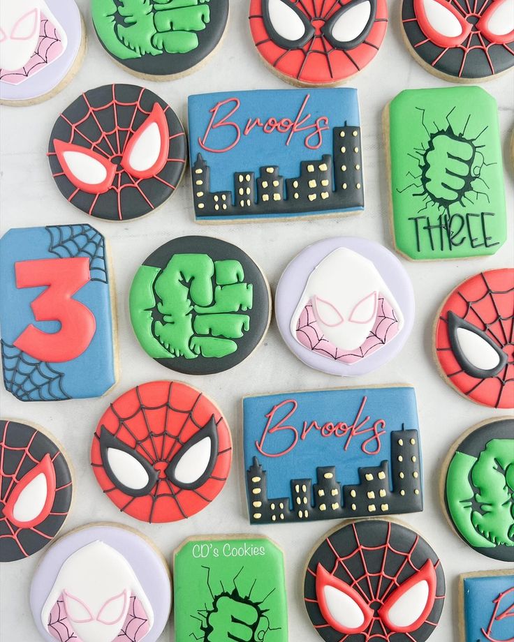 Comic-Inspired Colorful Cookie Designs Featuring Superhero Spider Motifs for Festive Treats.