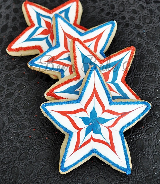 Vibrantly Decorated Star-Shaped Cookies with Eye-Catching Patterns for Festive Occasions.