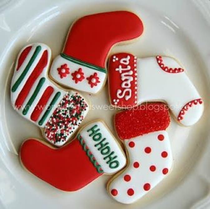 Festive Holiday Stocking-Shaped Cookies with Colorful Designs and Decorative Elements.