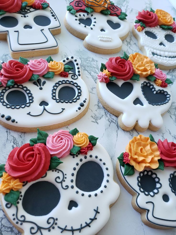 Vibrantly Decorated Sugar Cookies with Floral and Skull Motifs for Celebrations.