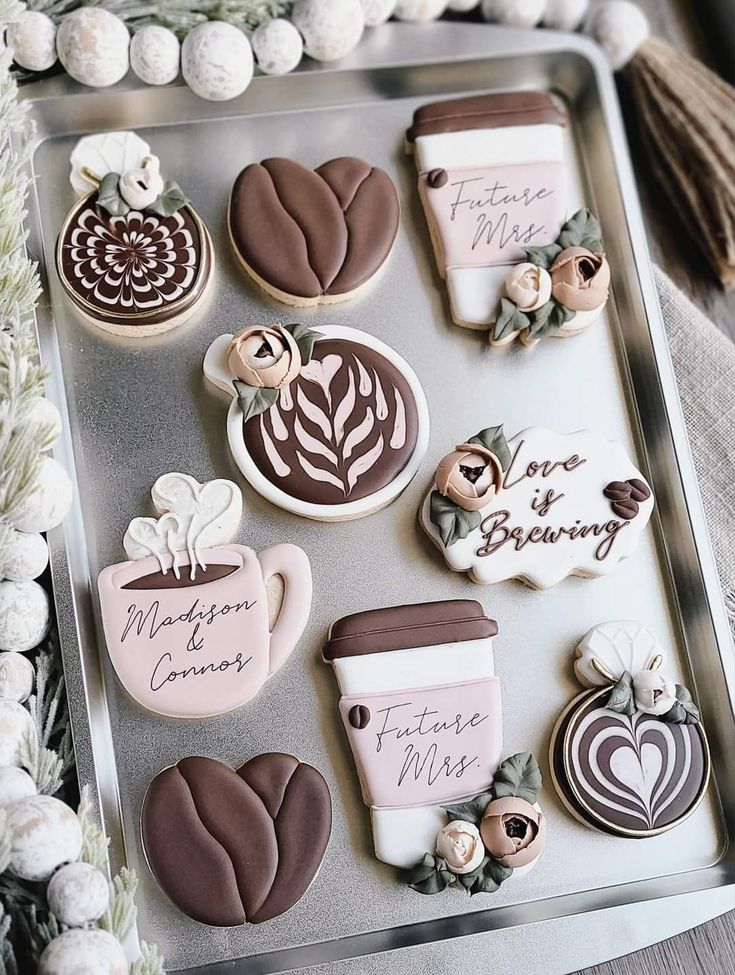 Intricate Floral and Coffee-Themed Cookies Create a Cozy, Elegant Celebration Aesthetic.