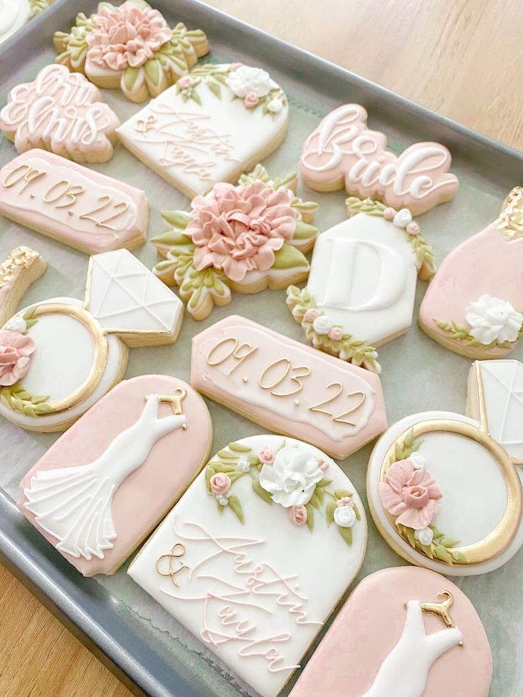 Elegant Wedding-Themed Cookies in Soft Pinks and Whites with Floral Designs