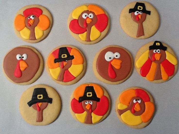 Cheerful Thanksgiving Cookies with Cartoonish Turkey Designs in Vibrant Colors.