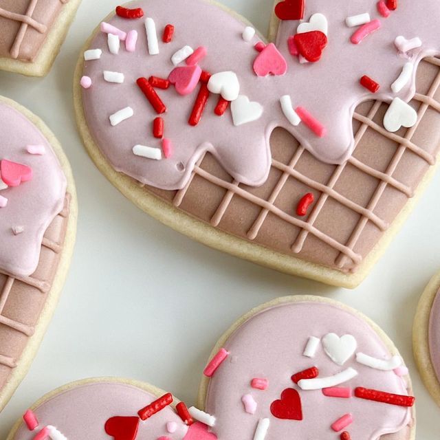 Whimsical Heart-Shaped Cookies with Colorful Icing and Festive Sprinkles.