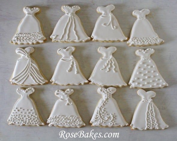 Delicate Dress-Shaped Cookies: Artful Icing for Special Occasions.