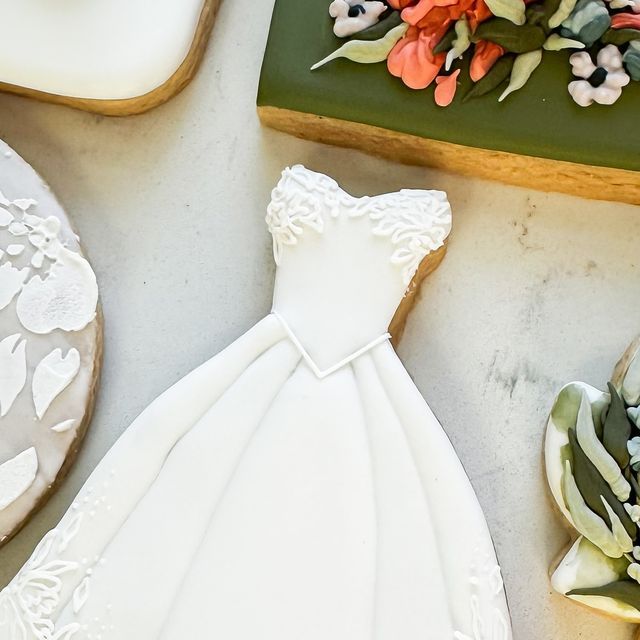 Elegant Wedding Dress Cookie with Intricate Icing Details for Bridal Showers and Weddings.