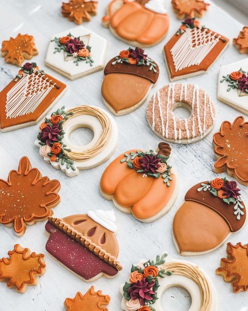 Elegant Autumn Cookie Designs with Festive Shapes and Intricate Icing.