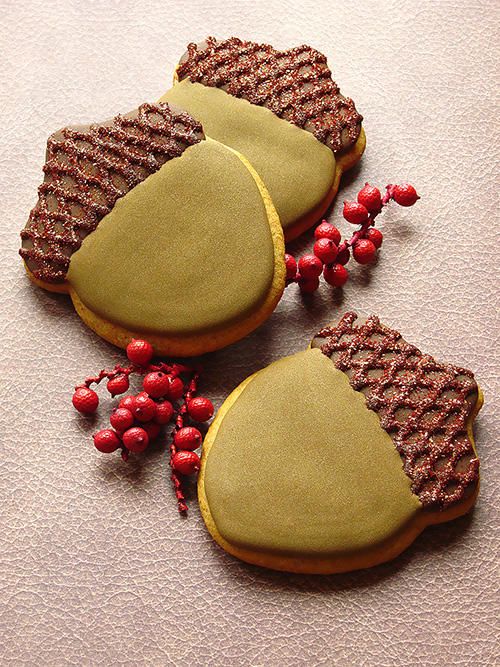 Delightful Acorn-Shaped Cookies with Rich Chocolate Coating and Vibrant Berry Accents