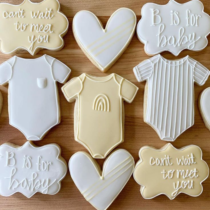 Whimsical Baby-Themed Cookie Designs in Pastel Colors for Celebrations.