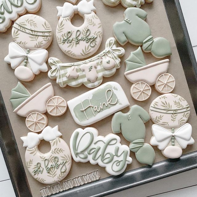 Charming Baby-Themed Cookies in Pastel Hues for Celebratory Occasions.