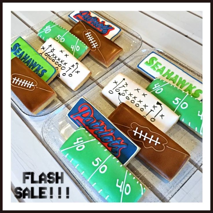 Vibrant Football-Shaped Cookies with Team Logos for Festive Sports Events.