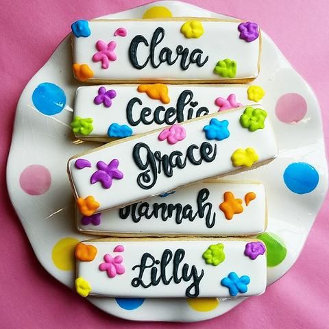 Cheerful Display of Colorfully Decorated Cookies on a Polka-Dotted Plate.