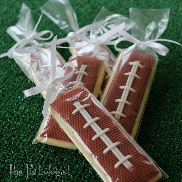 Elegant Football-Themed Cookies with Detailed Icing and Stylish Packaging for Sports Celebrations.