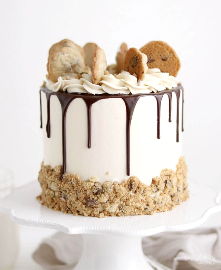 Decadent Cake Design with Creamy Frosting, Chocolate Drip, and Cookie Toppings.