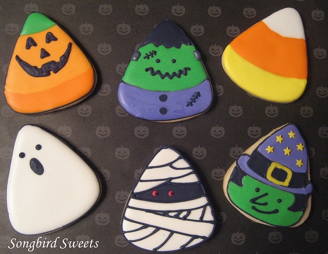 Festive Halloween Cookies: Adorable Designs of Jack-o'-Lanterns, Ghosts, and Frankensteins.