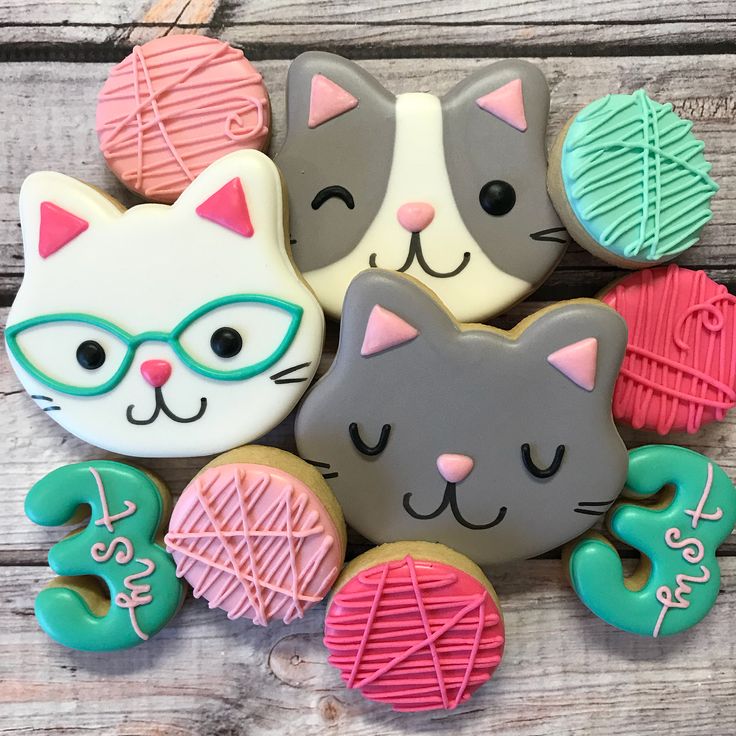 Whimsical Cat Face Cookies Inspire Playful Nail Designs in Soft Pastels.