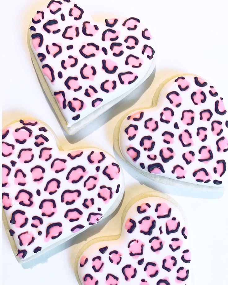 Bold Heart-Shaped Nail Design: Trendy Pink and Black Leopard Print for a Playful Manicure.