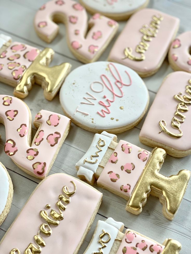 Playful Themed Decorative Cookies with Elegant Pink and Gold Accents