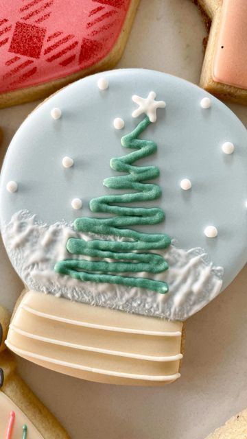 Whimsical Pastel Christmas Tree Snow Globe Cookie Design