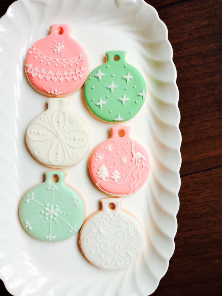 Festive Colorful Ornament-Shaped Cookies with Delicate Pink and Green Designs