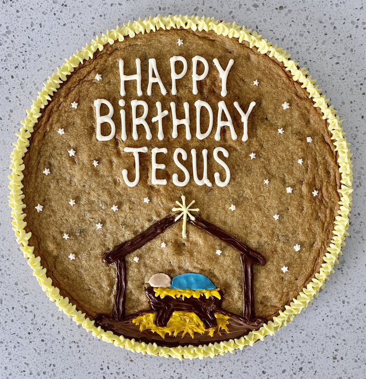 Vibrant Festive Cookie Cake Featuring Nativity Scene and Cheerful Birthday Message.