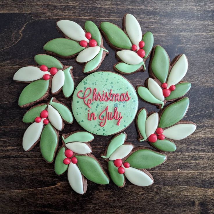 Cheerful Holiday Cookie Wreath Design with Green Leaves and Red Berries for Christmas in July.