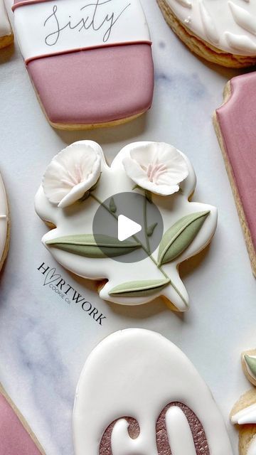 Elegant Floral-Themed Cookie Designs with Pastel Colors and Leaf Detailing.