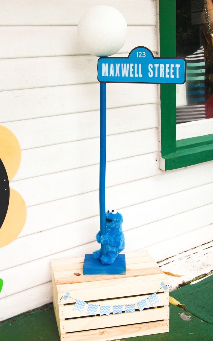 Whimsical Street Sign with Cheerful Character and Vibrant Decor.