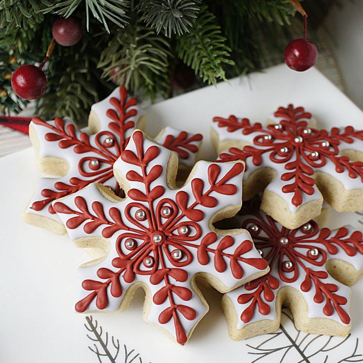 Intricately Designed Red and White Snowflake Cookies: A Festive Holiday Treat