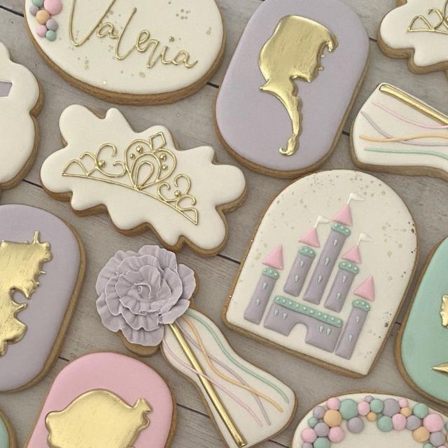 Whimsical Pastel Cookies with Elegant Gold Accents for Celebrations.