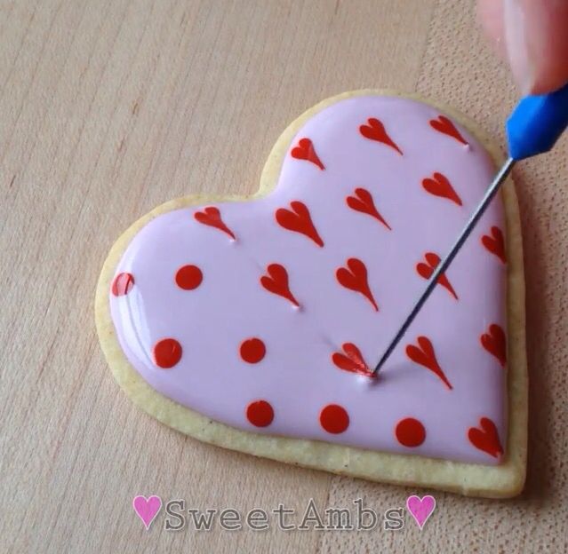 Beautifully Decorated Heart-Shaped Cookie with Vibrant Icing for Festive Celebrations.