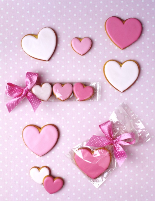 Charming Heart-Shaped Cookies Inspire Whimsical Dessert Table and Romantic Nail Design.