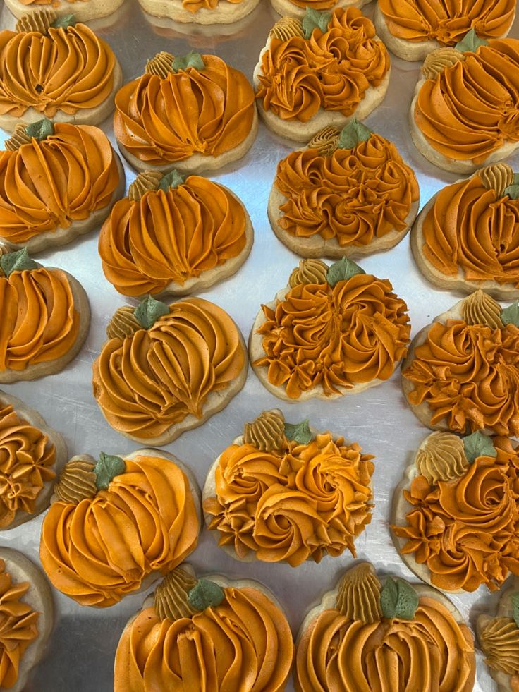 Festive Pumpkin Cookies with Vibrant Frosting for Autumn Celebrations.