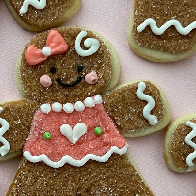 Vibrantly Decorated Gingerbread Cookie Inspires Whimsical Nail Art Concept.