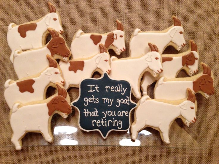 Whimsical Goat-Shaped Cookie Display with Creative Sign Adds Charm to Centerpiece.