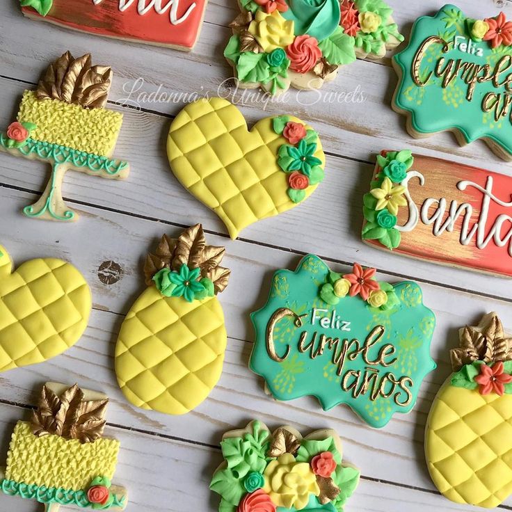 Tropical-Inspired Colorful Cookies with Pineapples and Floral Accents.