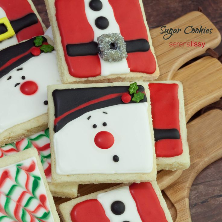 Festive Decorative Sugar Cookies with Vibrant Santa and Snowman Designs.