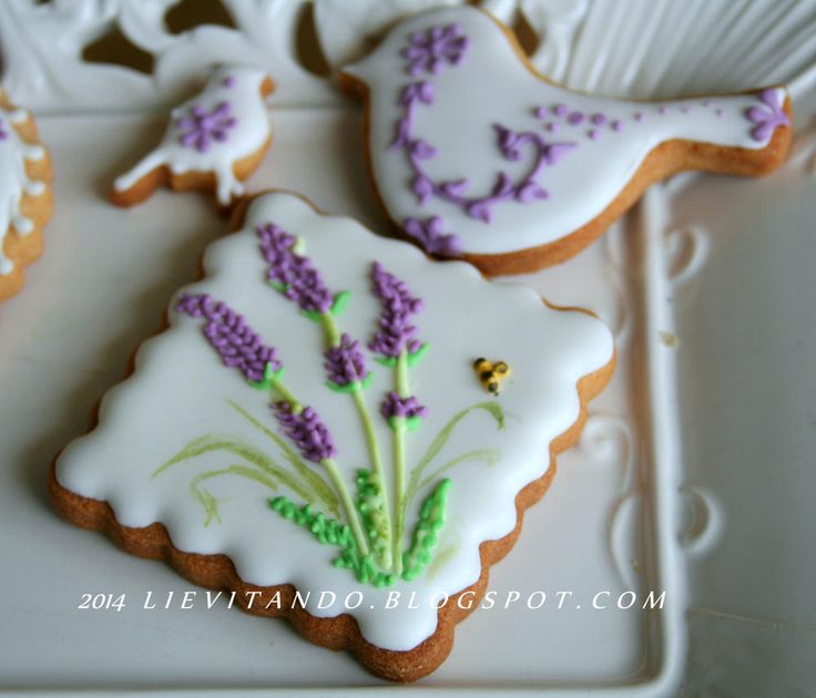 Charming Floral-Designed Cookies with Lavender and Bee Motifs for Special Occasions.