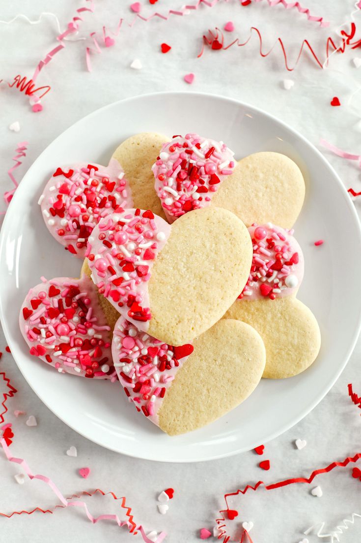 Festive Heart-Shaped Cookies with Colorful Icing and Heart Confetti: Perfect for Celebrations