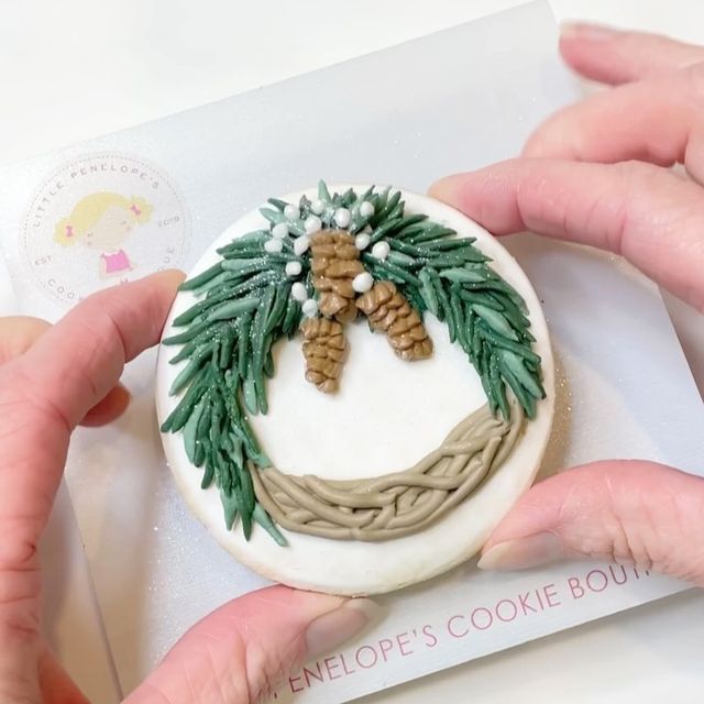 Festive Wreath Motif Cookie Design with Green Icing and Textured Pinecones