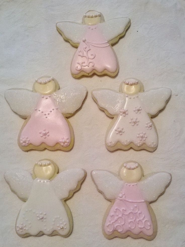 Whimsical Angel-Shaped Cookies Adorned with Elegant Icing for Festive Celebrations.