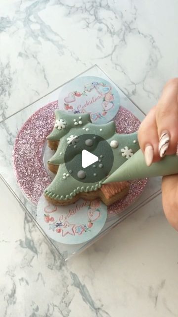 Festive Nail Art: Elegant Silver Meets Playful Cookie Design for Holiday Cheer